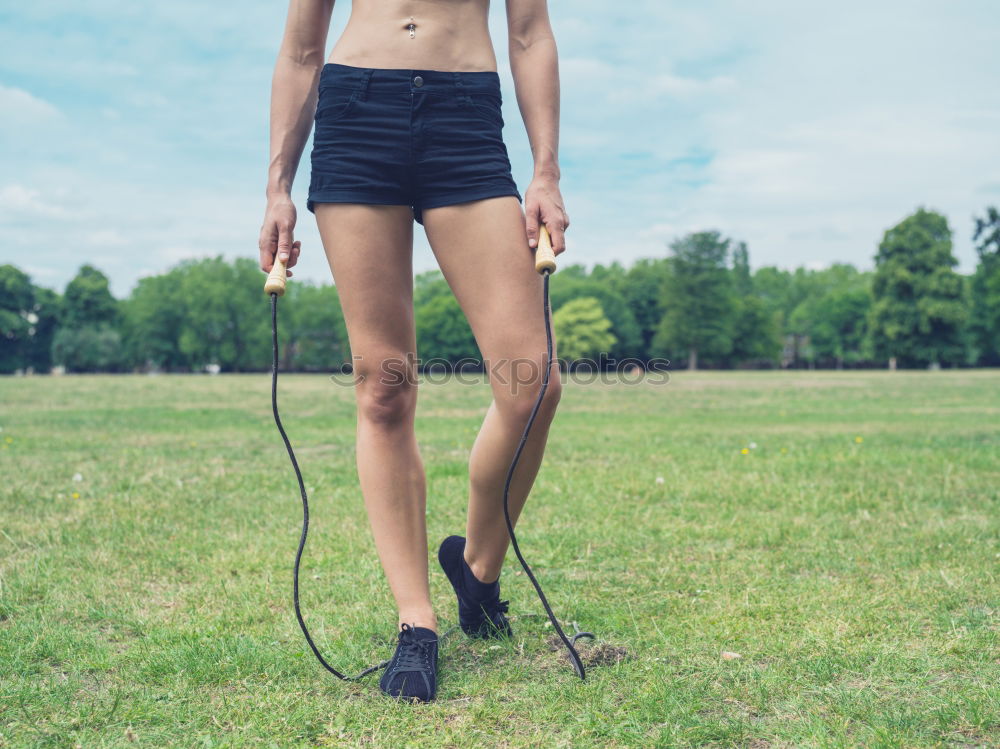 Similar – Image, Stock Photo Sportswoman doing leg stretches