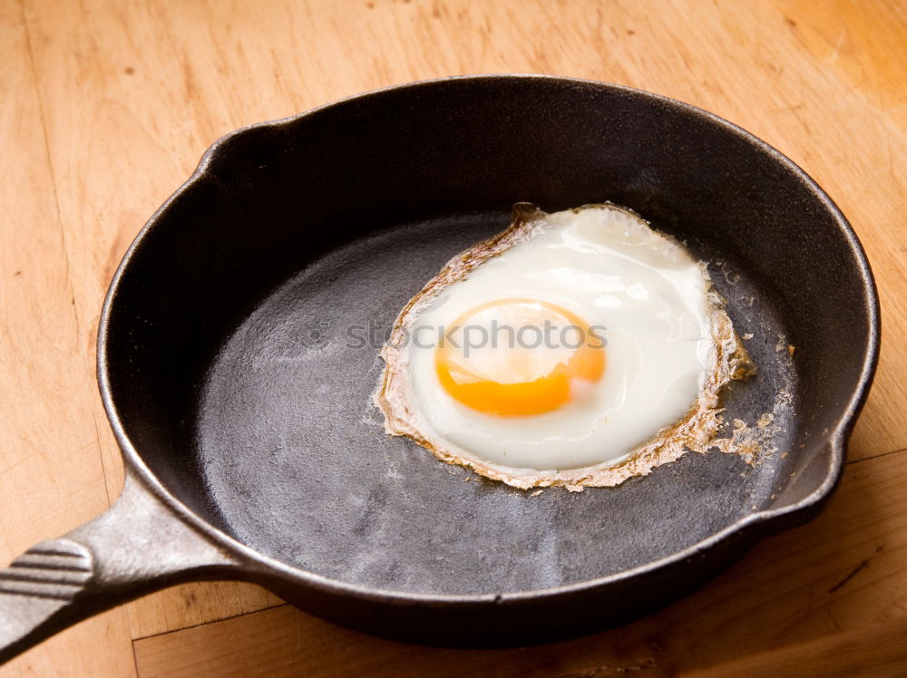 Similar – Image, Stock Photo Fried egg face with slice of bread