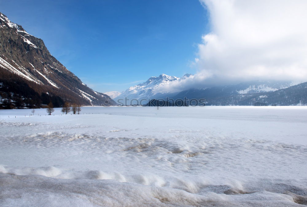 Similar – Snow-capped mountains and frozen river