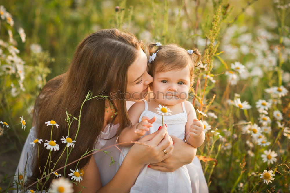 Similar – Happy mother and daughter playing in the park at the day time. Concept of celebration Mothers day .