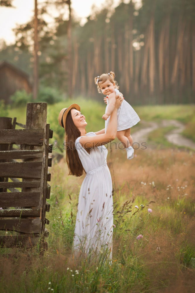 Similar – Image, Stock Photo analog medium format photo: young blond Labrador in forest with tall dark haired woman with wild curls smiling at camera