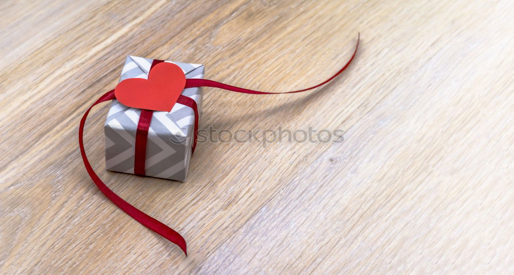 Similar – Image, Stock Photo colourful christmas parcels packed with christmas paper with red bow, on rustic wood. Christmas presents, lie nicely decorated with ribbon on wooden table. Many Christmas parcels wrapped with wrapping paper with Christmas motif. Concept gifts Advent.