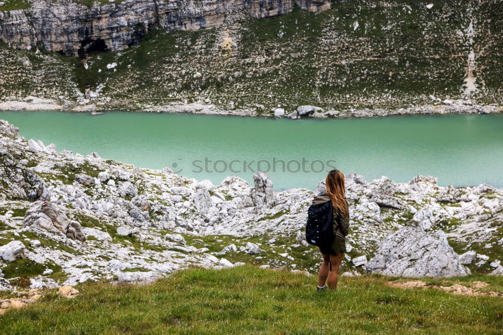 Similar – Women at lake in mountains