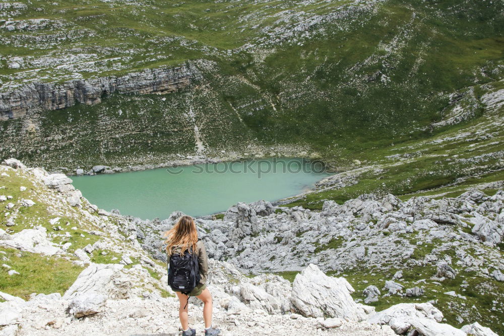 Similar – Women at lake in mountains