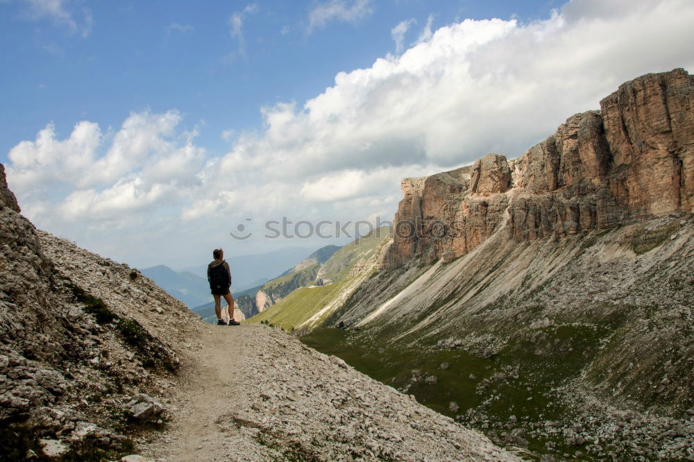 Similar – Hiking trail with hiker with panoramic view in the Dolomites