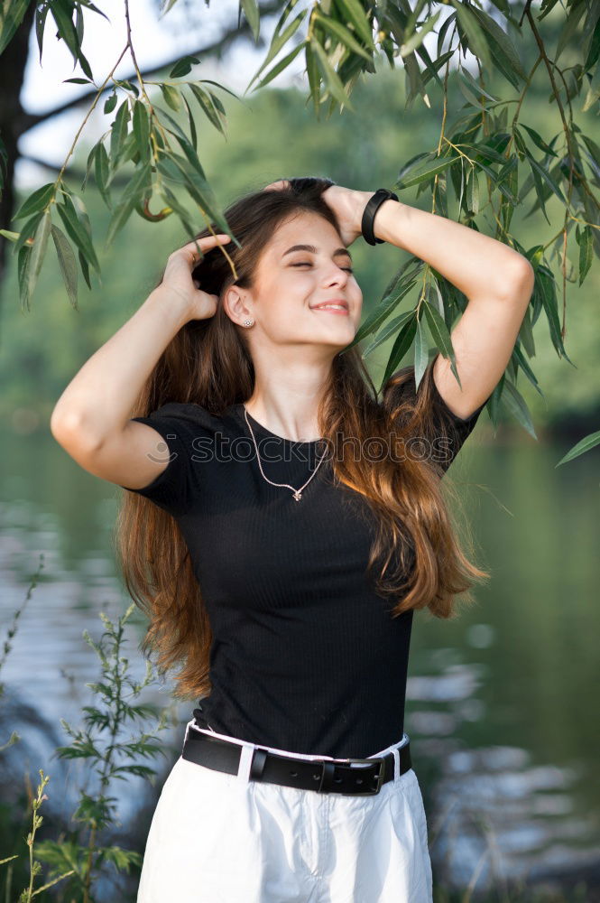 Similar – Foto Bild Frau mit Rock und Bluse greift sich in Haare