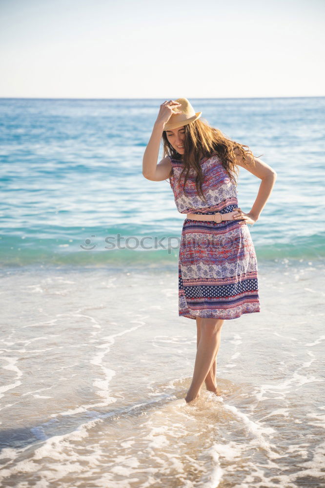 Similar – Image, Stock Photo Backlit portrait of a young woman in a summer dress standing with her feet in water