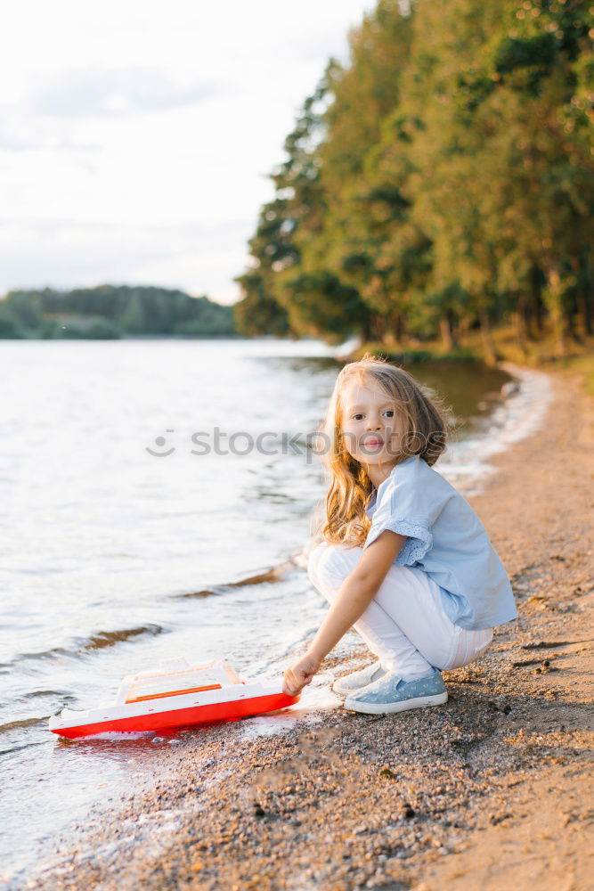 Similar – Image, Stock Photo Young girl sitting on jetty over the lake and dipping feet in water on sunny day in the summertime