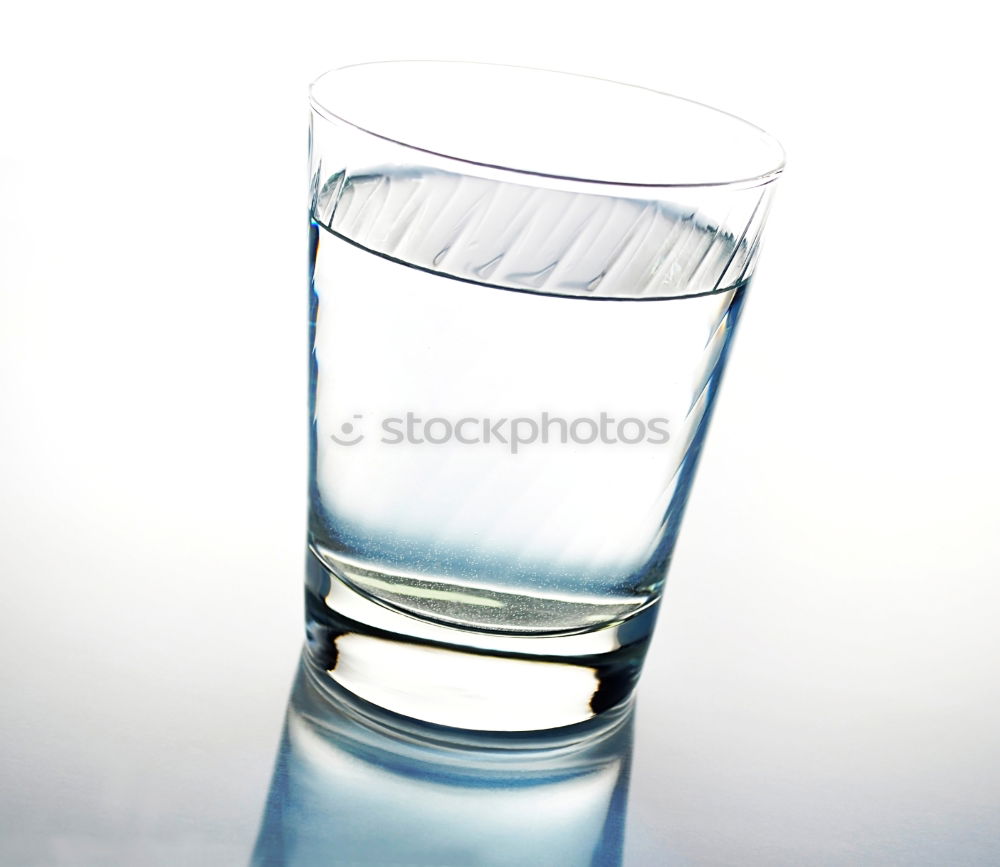 Similar – Glass filled to the brim with water in monochrome blue.