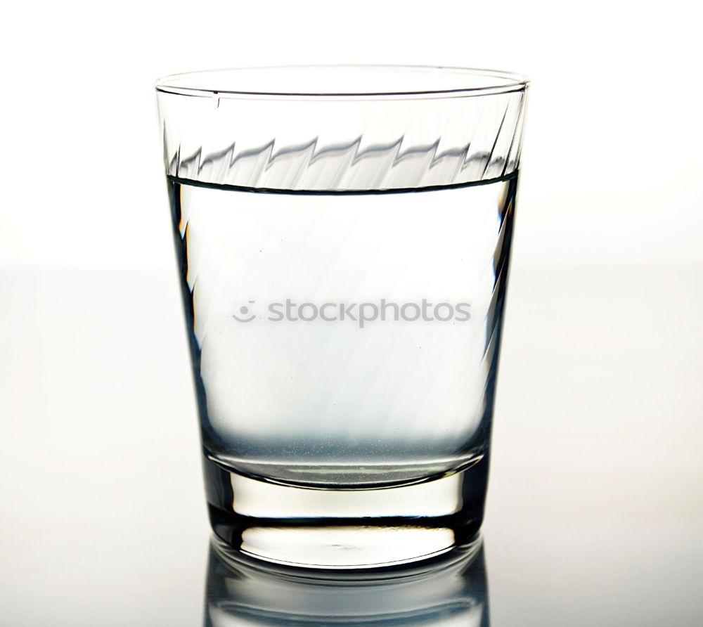 Similar – Water glass half full or half empty