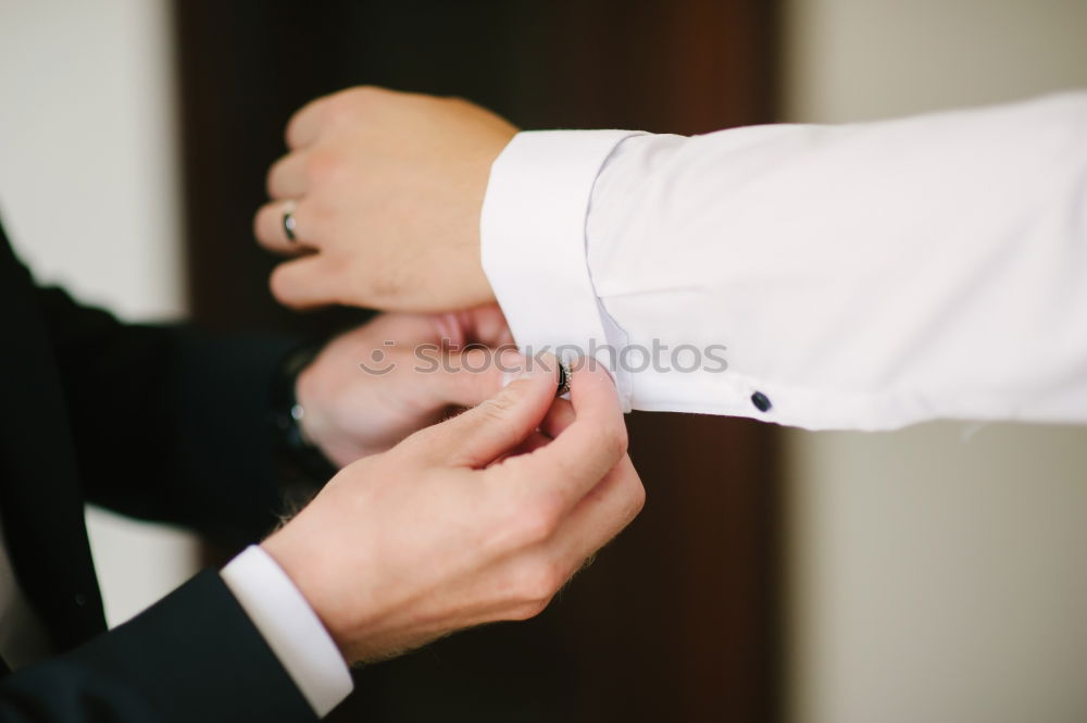 Similar – Image, Stock Photo Woman buttoning up man waistcoat