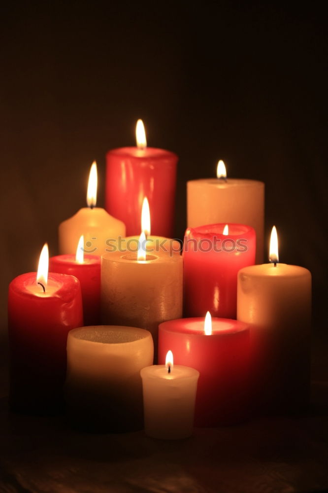 Similar – Image, Stock Photo A match lights the fire of many candles