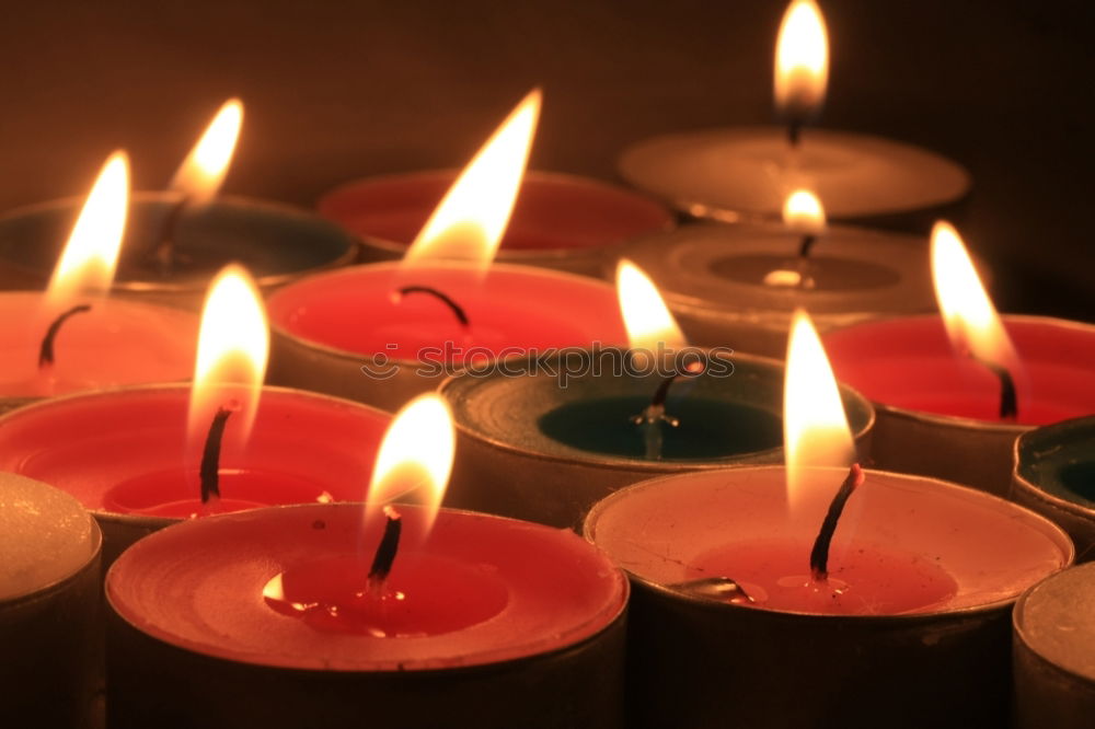 Similar – Image, Stock Photo A match lights the fire of many candles