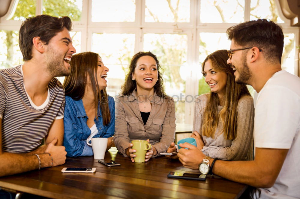 Similar – Happy family at home in the couch playing classic table games