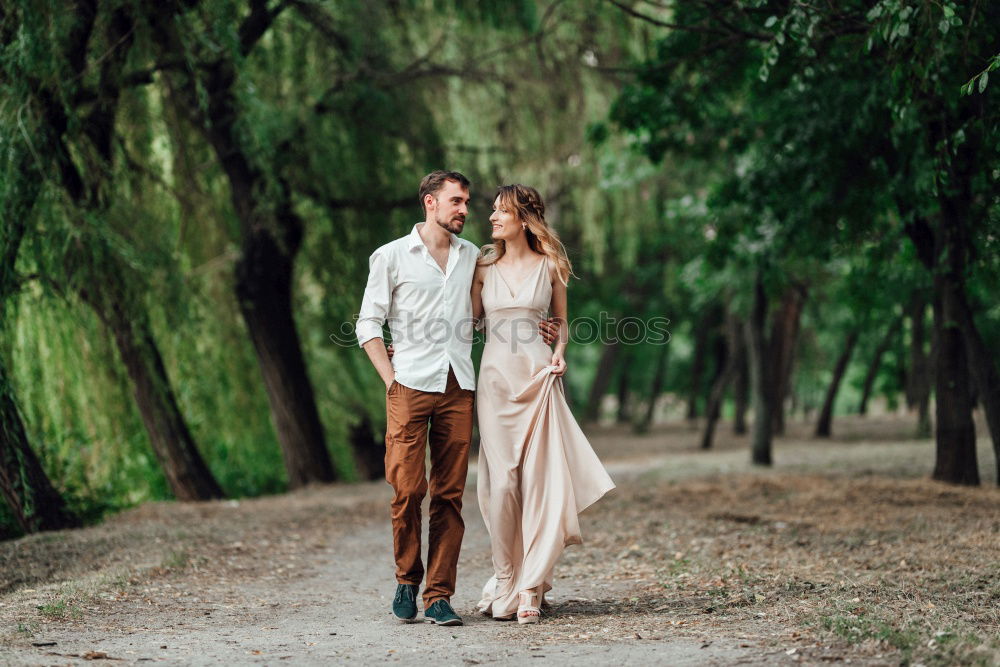 Similar – Image, Stock Photo Coupole holding hands standing on a road