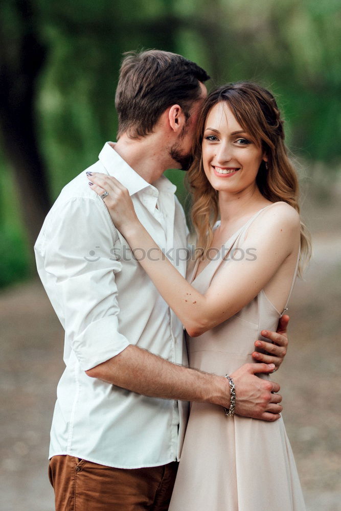 Image, Stock Photo Young loving couple kissing in the street.