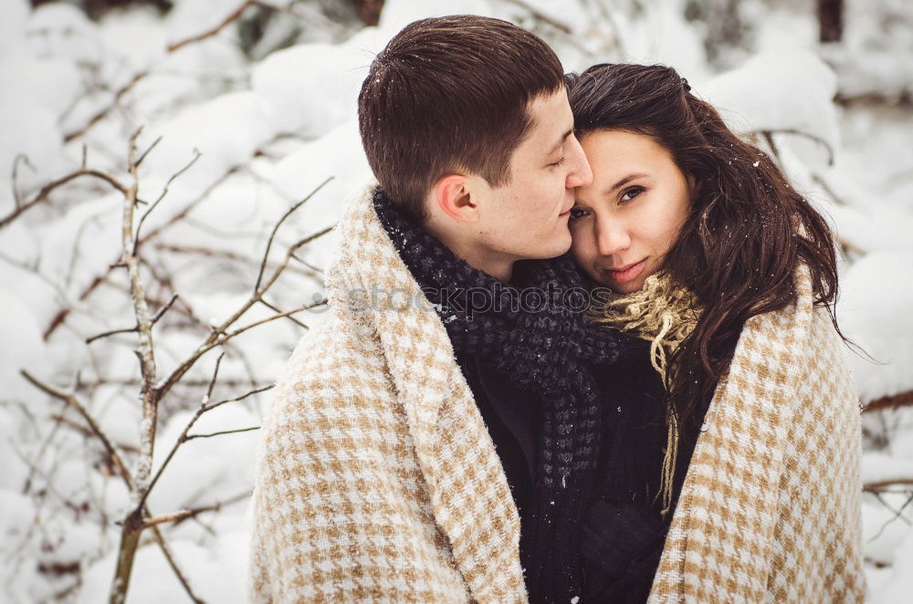 Similar – Woman with gift box in hand embracing and kissing to boyfriend