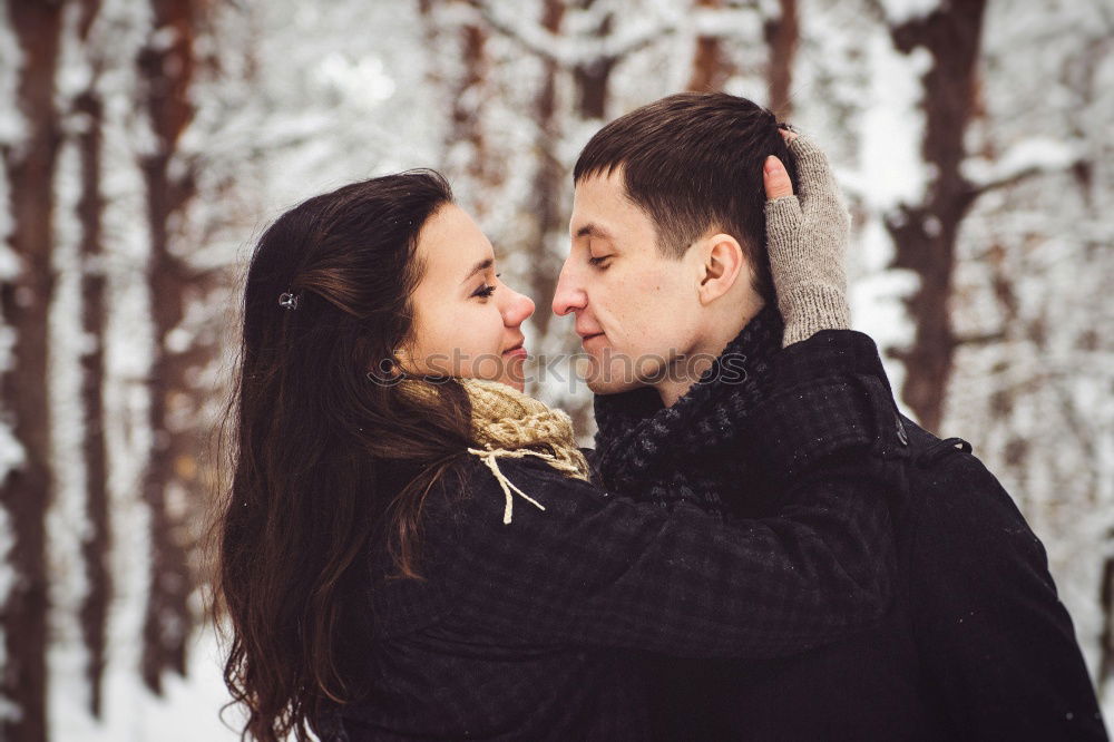 Similar – Woman with gift box in hand embracing and kissing to boyfriend