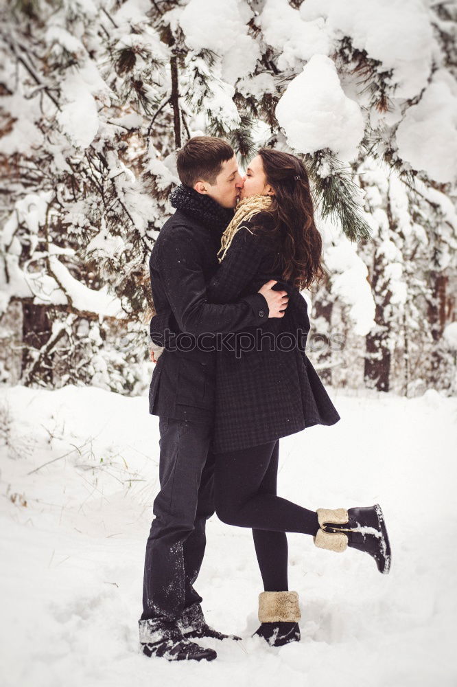 Similar – Couple having fun in winter forest