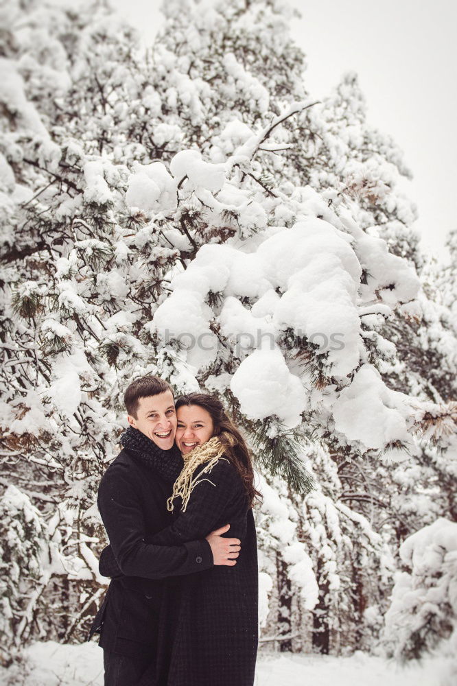 Similar – Couple having fun in winter forest