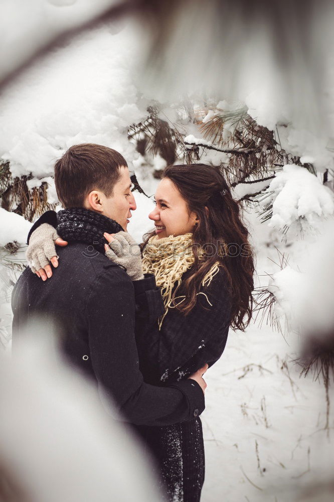 Similar – Image, Stock Photo Young couple kissing and holding cups of hot drink outdoors