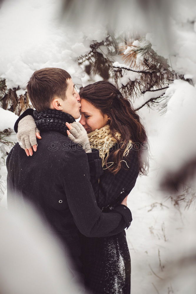 Similar – Woman with gift box in hand embracing and kissing to boyfriend