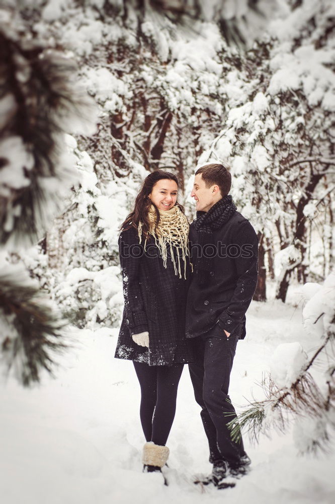 Similar – Couple having fun in winter forest