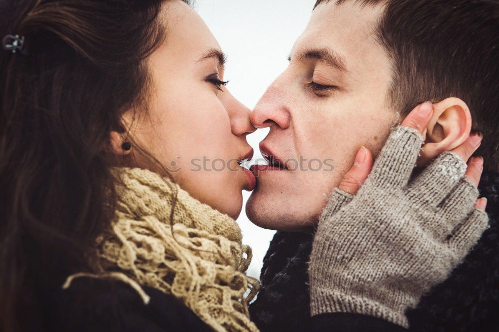 Similar – Woman with gift box in hand embracing and kissing to boyfriend