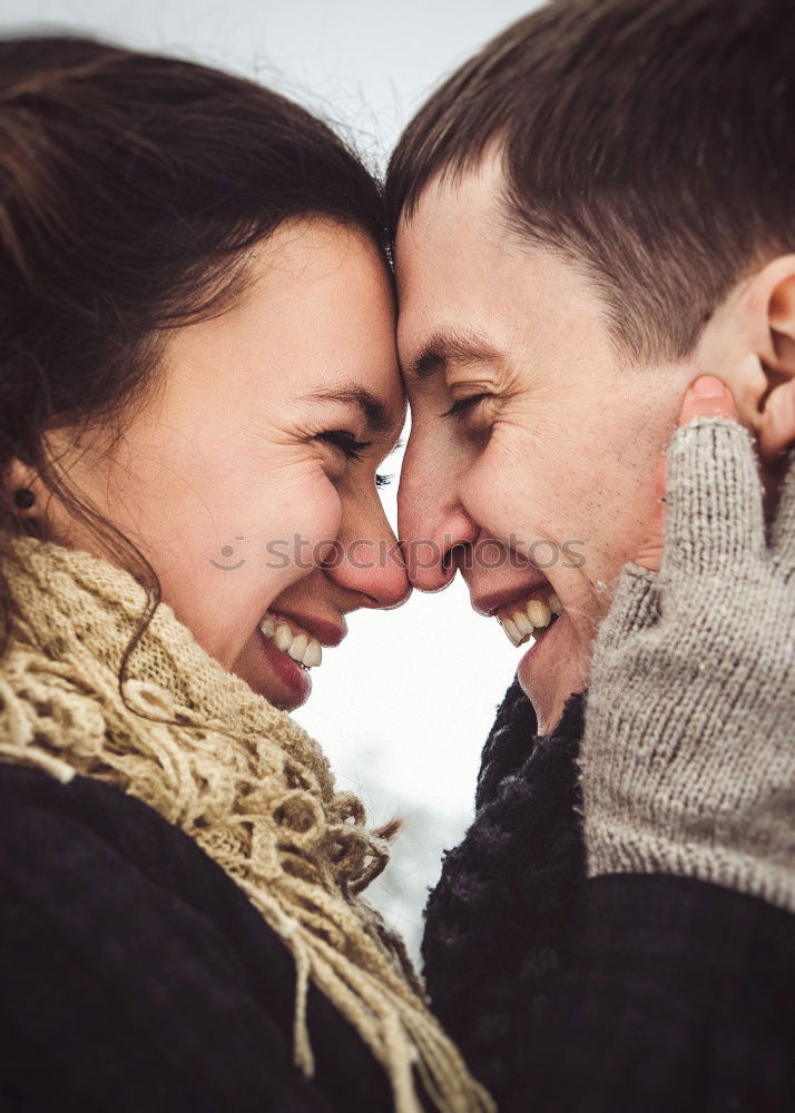 Similar – Young couple embracing and laughing outdoors under umbrella