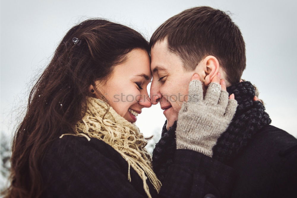 Similar – Young couple embracing and having hot beverage outdoors