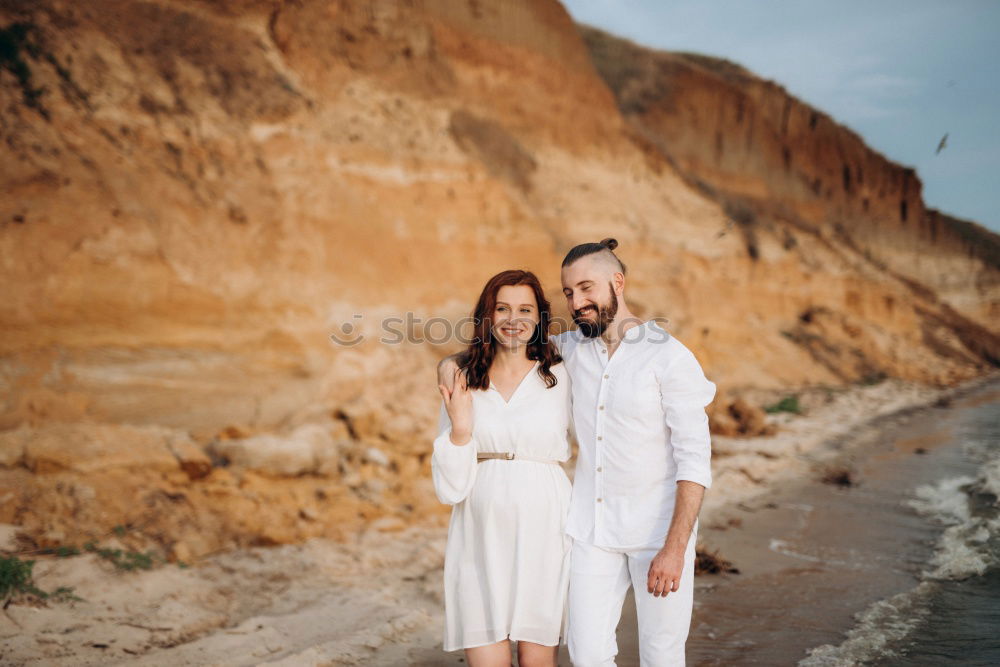 Similar – Mixed race couple on the beach, honeymoon