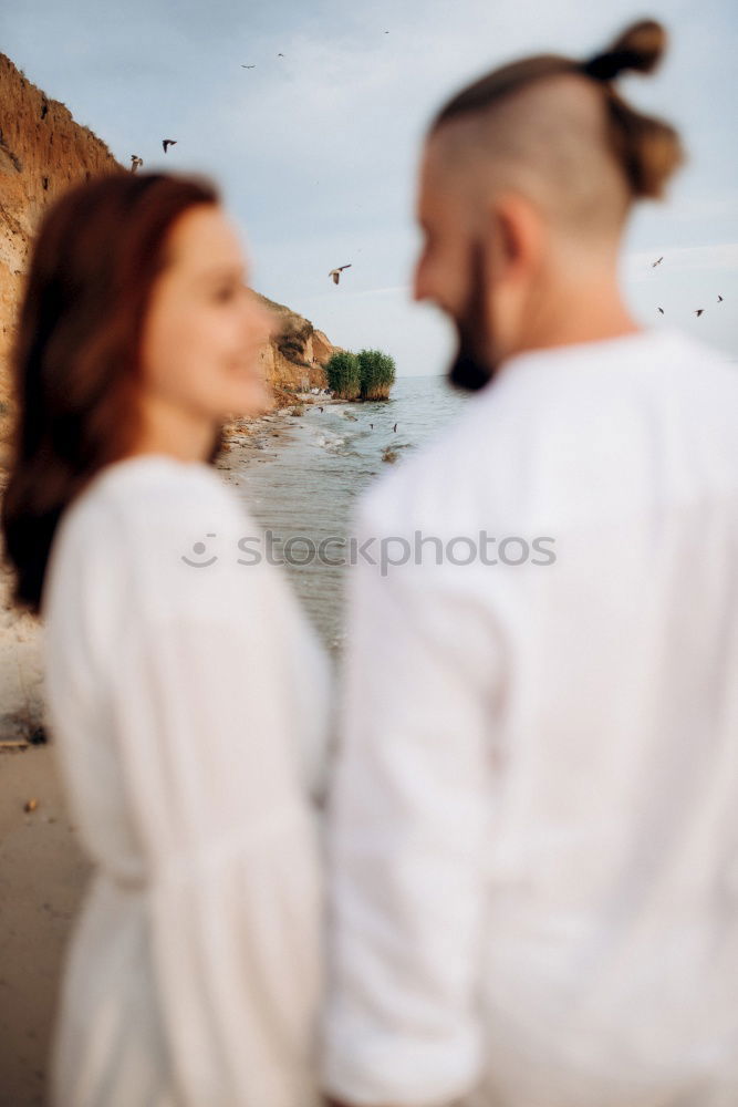 Image, Stock Photo Blonde woman and bearded man taking a walk embraced outdoors at sunset.