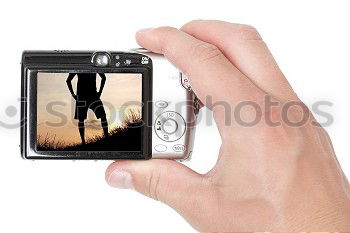 Similar – Full body image in the ground glass of an analog medium format camera of a tall beautiful woman with long dark curly hair in nature sitting barefoot under a tree