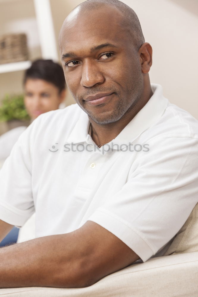 Similar – Image, Stock Photo Portrait of a young thoughtful mixed race man sitting in the sofa