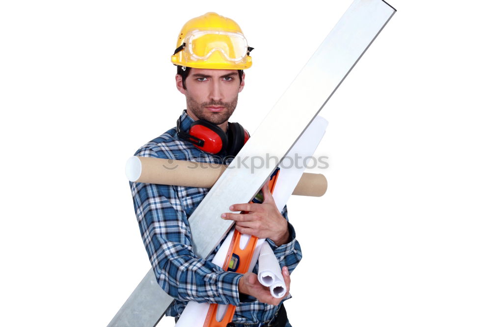 Similar – Worker man with hammer drill and building level at construction site