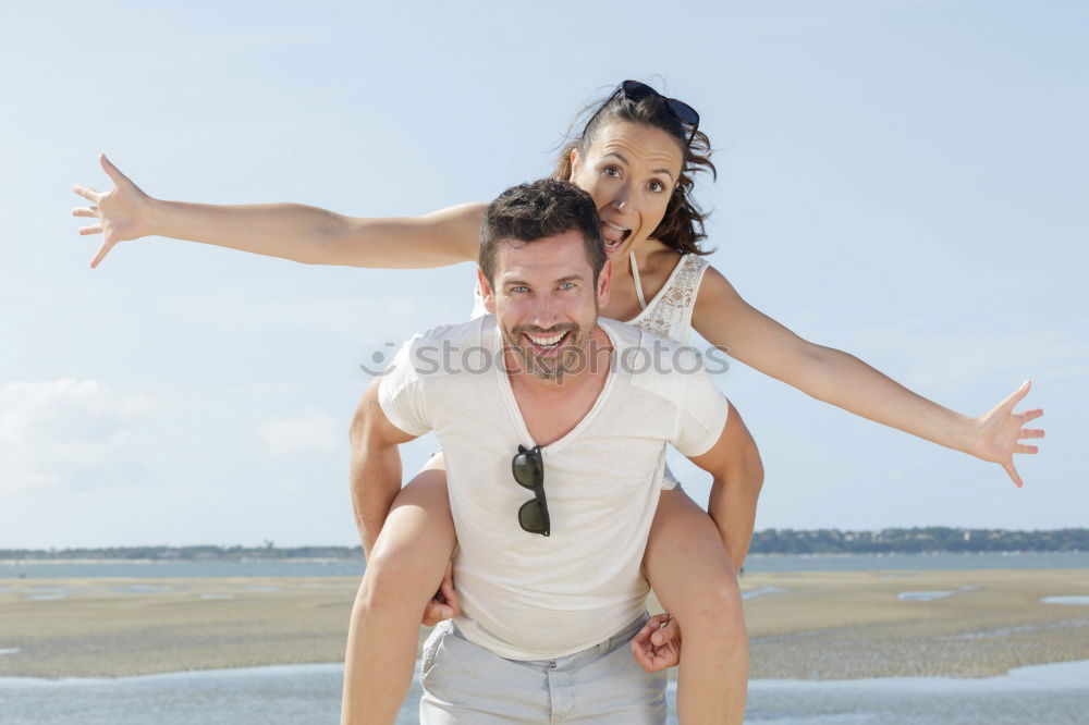 Similar – Father and daughter playing on the beach at the day time.