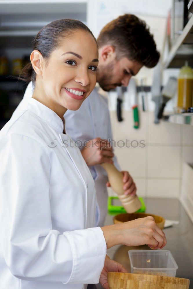 Young couple cooking. Man and woman in their kitchen