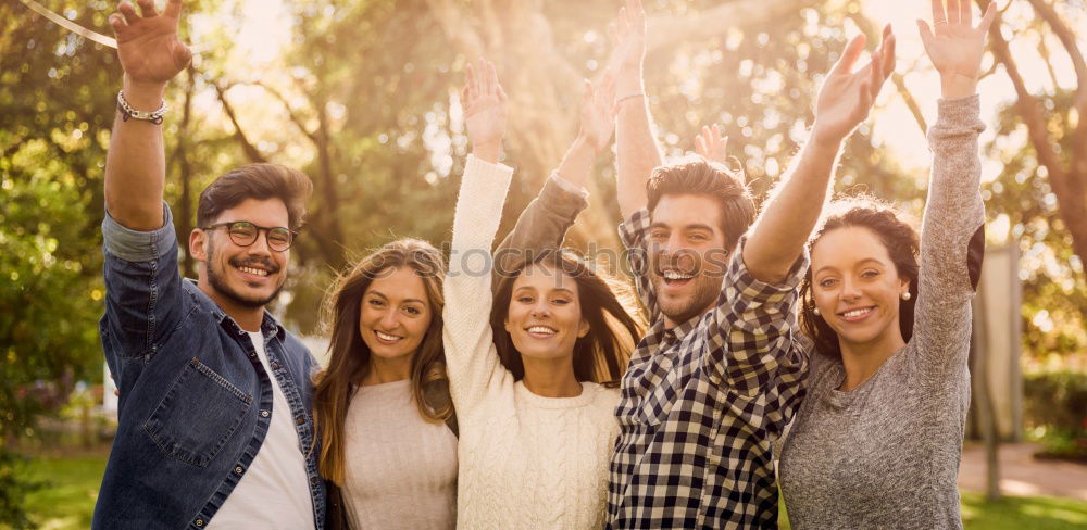 Similar – Group of young people together outdoors in urban park.