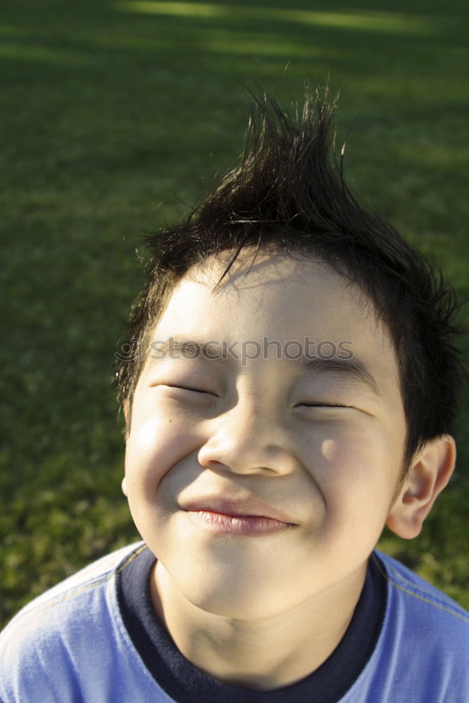 Similar – Boy sticks out his tongue