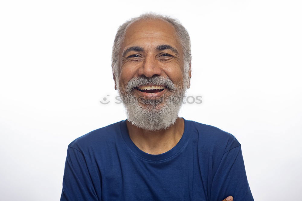 Similar – Portrait of a smiling senior with grey hair and grey beard in front of a grey sky