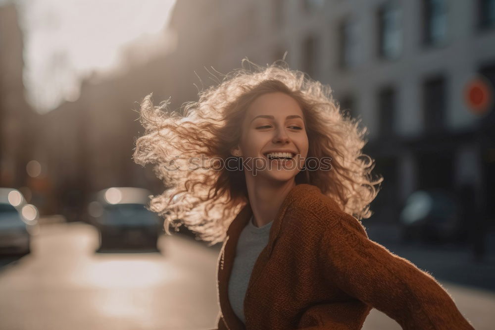 Similar – Image, Stock Photo Happy young woman with moving hair in urban background.