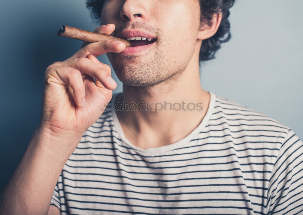 Similar – Stylish man chewing a gum