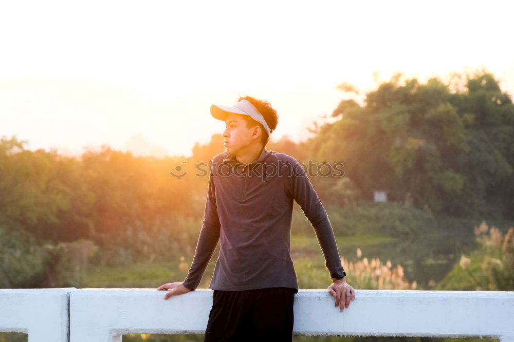 Similar – Woman tying hair in ponytail getting ready for run.