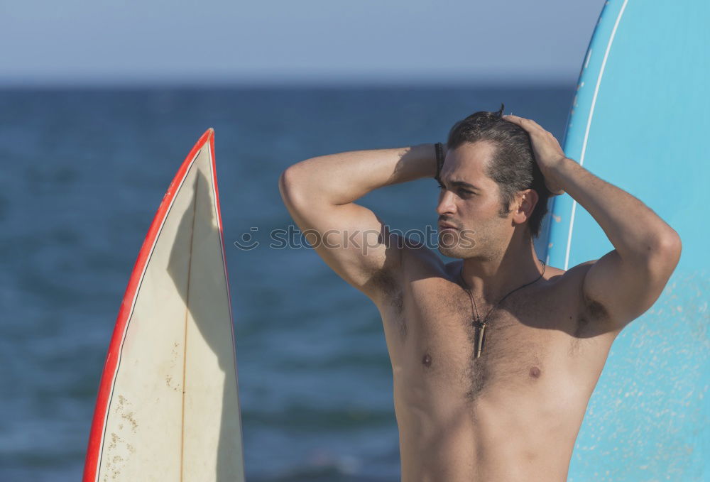 Similar – Young attractive surfer holding his surfboard at the beach