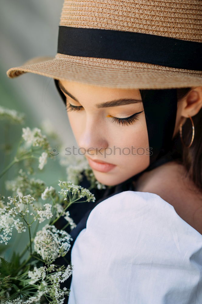 Similar – Young woman hidden behind a plant