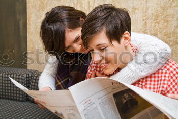 Similar – Image, Stock Photo Two male teenagers browsing the internet in cafe. Entertaining with electronics