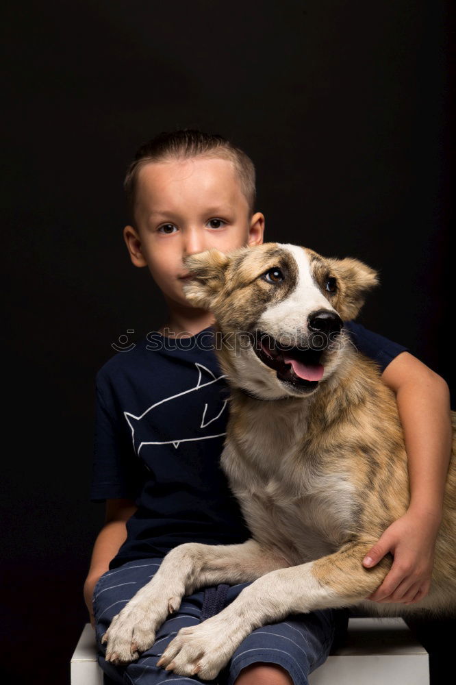 Similar – boy hugging his dog