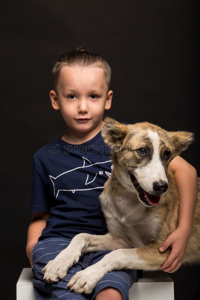 Similar – boy hugging his dog