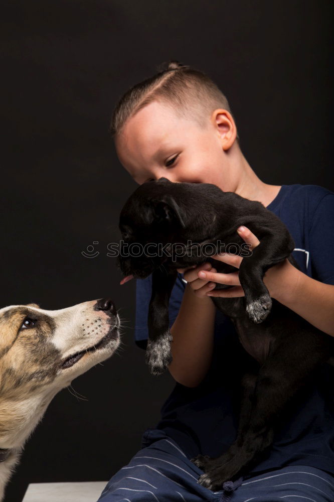 boy hugging his dog