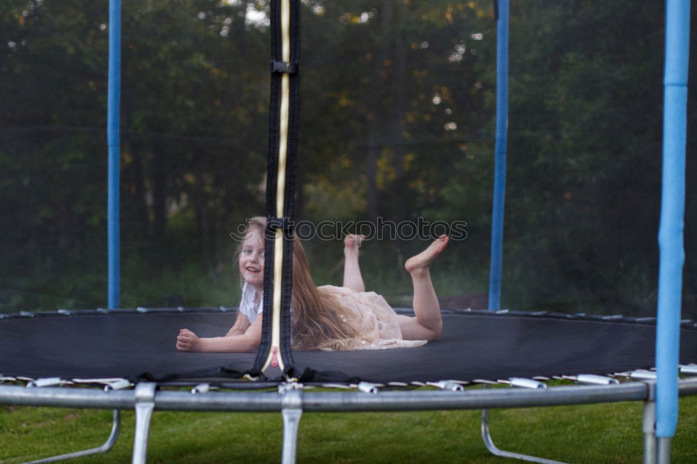 Similar – bouncing kid on trampoline